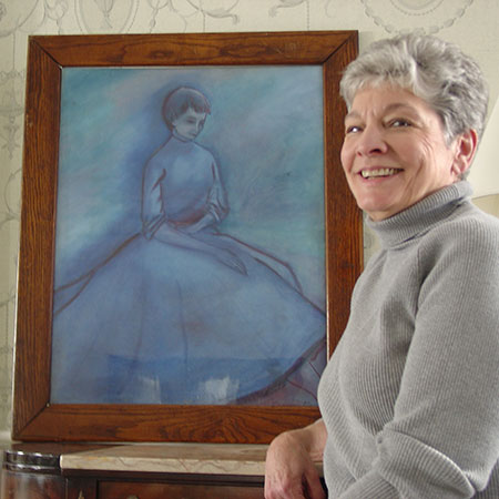 Alumna Evelyn McMillan Burchett Brodland '59 poses next to her painting of the Blue Lady.